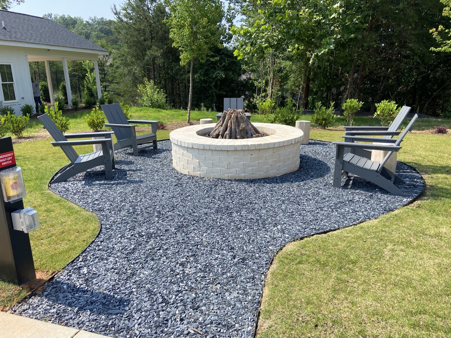 Community firepit surrounded by outdoor seating