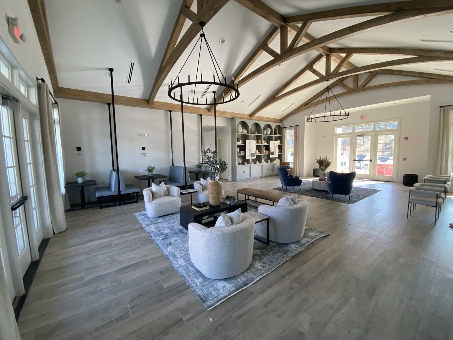 Completed Cartersville clubhouse gathering room with exposed timber trusses