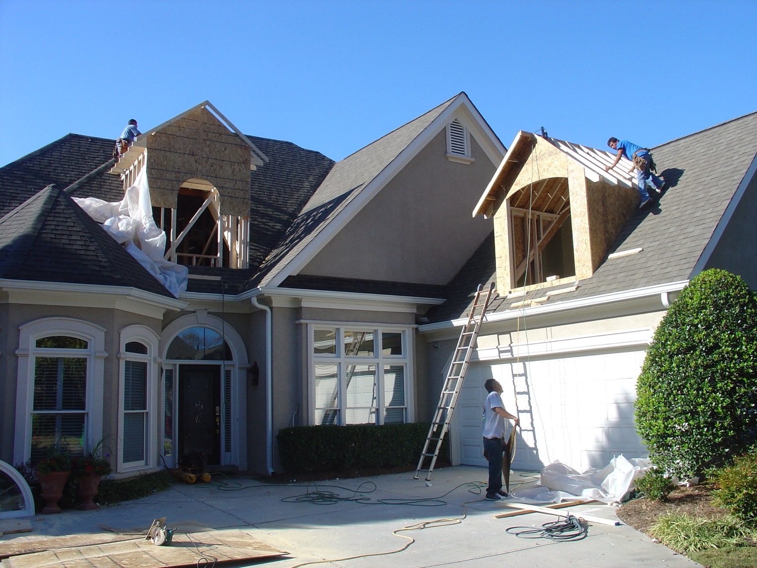 Dormer additions under construction on an existing residence